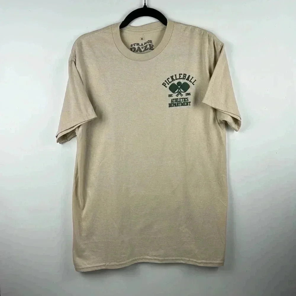 PICKLEBALL TEE SHIRT SZ M 100%COTTON STRANGE DAZE BEIGE /GREEN GRAPHICS SHORT SL